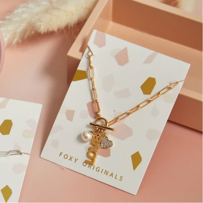 Foxy Originals PSILY Love Charm Necklace Gold lifestyle product shot on card — Cloud Nine Pajamas Edmonton