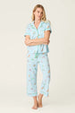PJ SALVAGE Whimsy Cropped PJ Set in Light Blue Putter Pup print showing dogs golfing. Model stands wearing the set against a light background