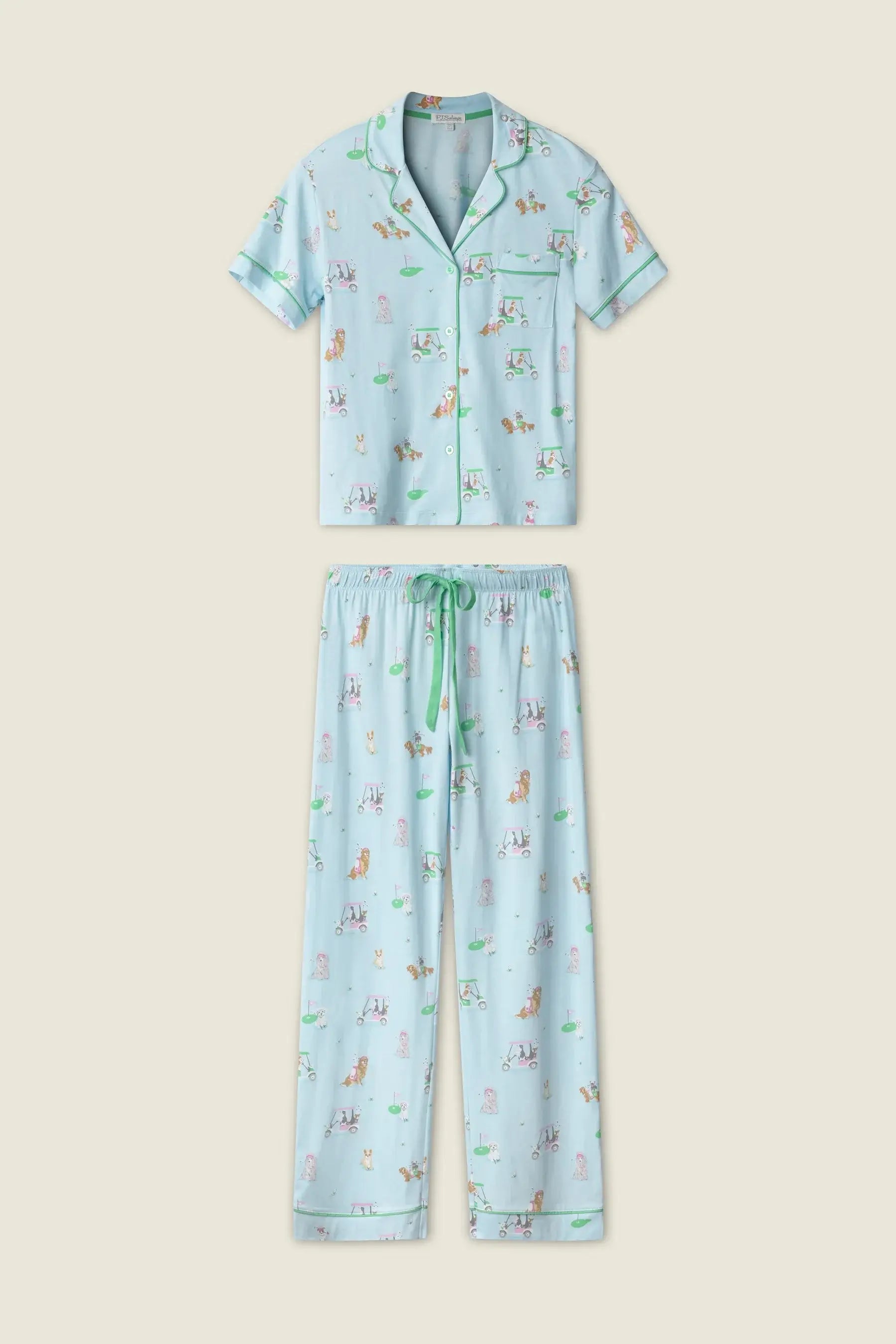 PJ SALVAGE Whimsy Cropped PJ Set in Light Blue Putter Pup print showing dogs golfing. Set shown in a lay flat against a light background