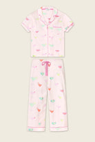 PJ SALVAGE Whimsy Cropped PJ Set in Light Pink Sip Happens print showing cocktail glasses in various colours. Set shown as a lay-flat against a light background