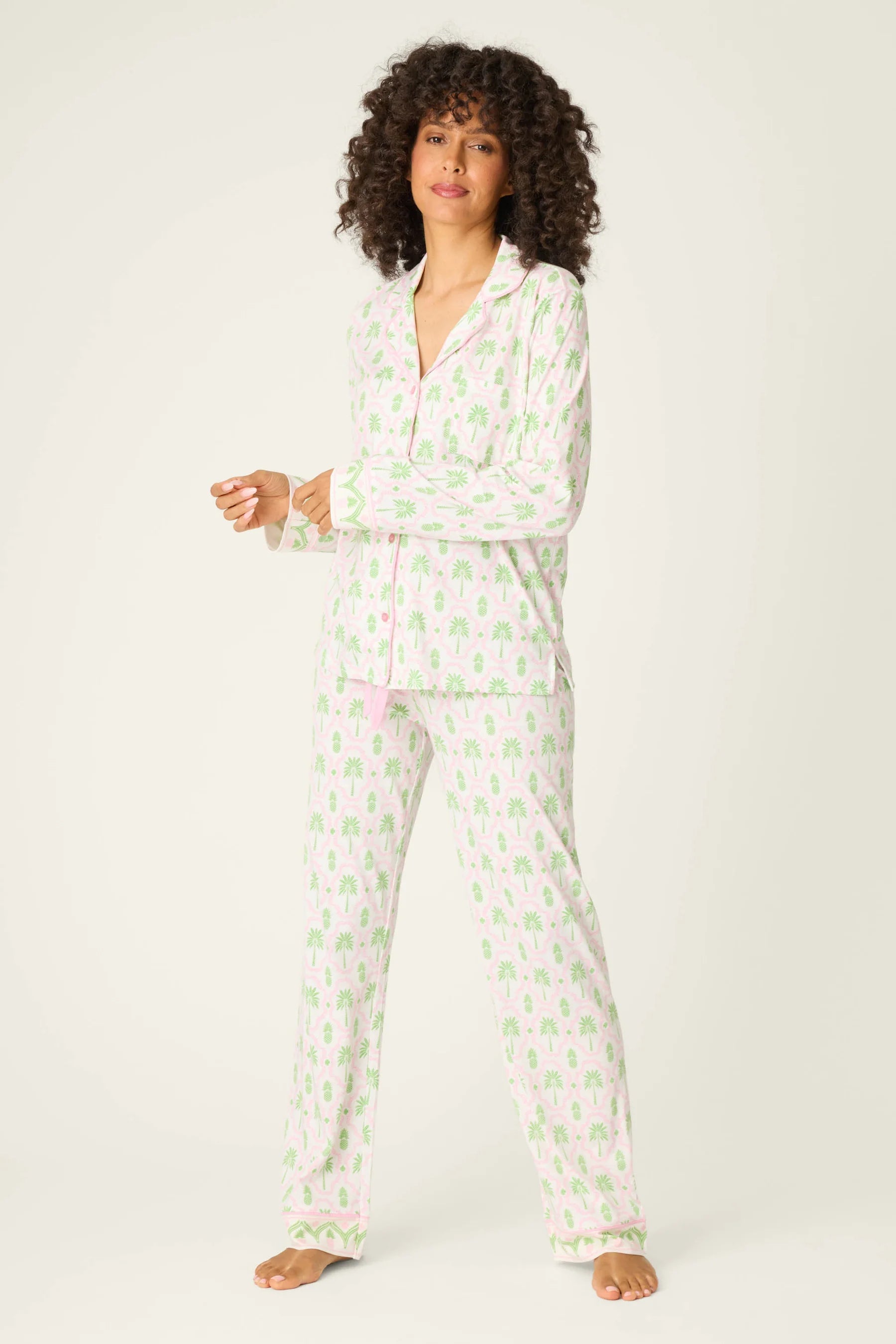 Playful Prints Cotton-Modal Long Sleeve Pajama Set by PJ Salvage displayed on a model with curly hair, in a playful pattern.