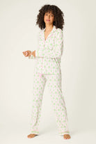 Playful Prints Cotton-Modal Long Sleeve Pajama Set by PJ Salvage displayed on a model with curly hair, in a playful pattern.