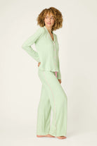 Pupcation Palms Vacay Mode Kiwi Stripe 3-Piece PJ Set PJ Salvage styled model wearing green pajamas.