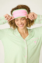 Pupcation Palms Vacay Mode Kiwi Stripe 3-Piece PJ Set PJ Salvage model wearing sleep mask and pajama top.