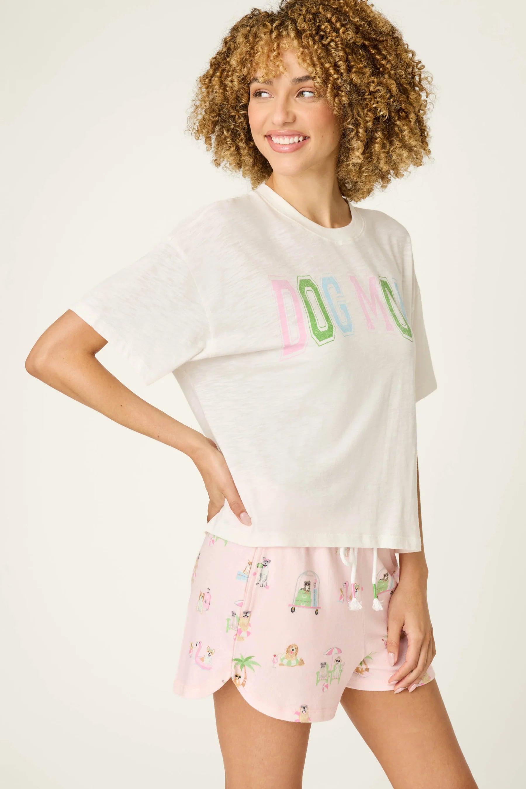 Pupcation Palms Dog Mom Graphic Tee by PJ Salvage worn with cute pajama shorts, showcasing stylish dog-themed fashion.
