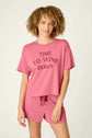 PJ SALVAGE Graphic Print Softee Tee & Short Lounge Set in "Time to Wine Down" rose pink. Model stands against a light background in a close-up shot