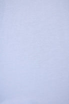 PJ SALVAGE Graphic Print Softee Tee & Short Lounge Set in "Nap Time is my Happy Hour" graphic tee shirt in light blue. Close up of the Fabric showing texture and colour of the softee set