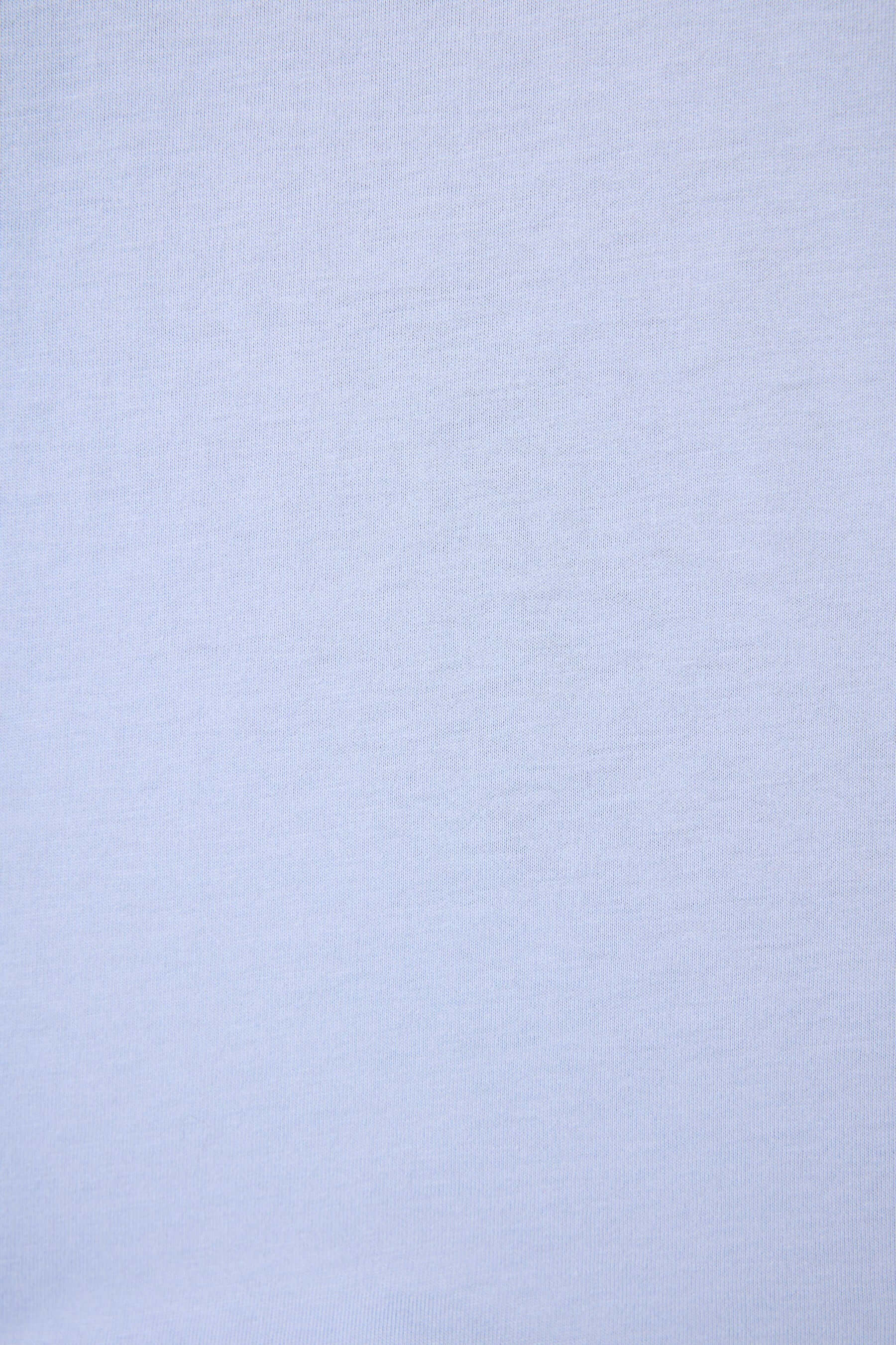 PJ SALVAGE Graphic Print Softee Tee & Short Lounge Set in "Nap Time is my Happy Hour" graphic tee shirt in light blue. Close up of the Fabric showing texture and colour of the softee set