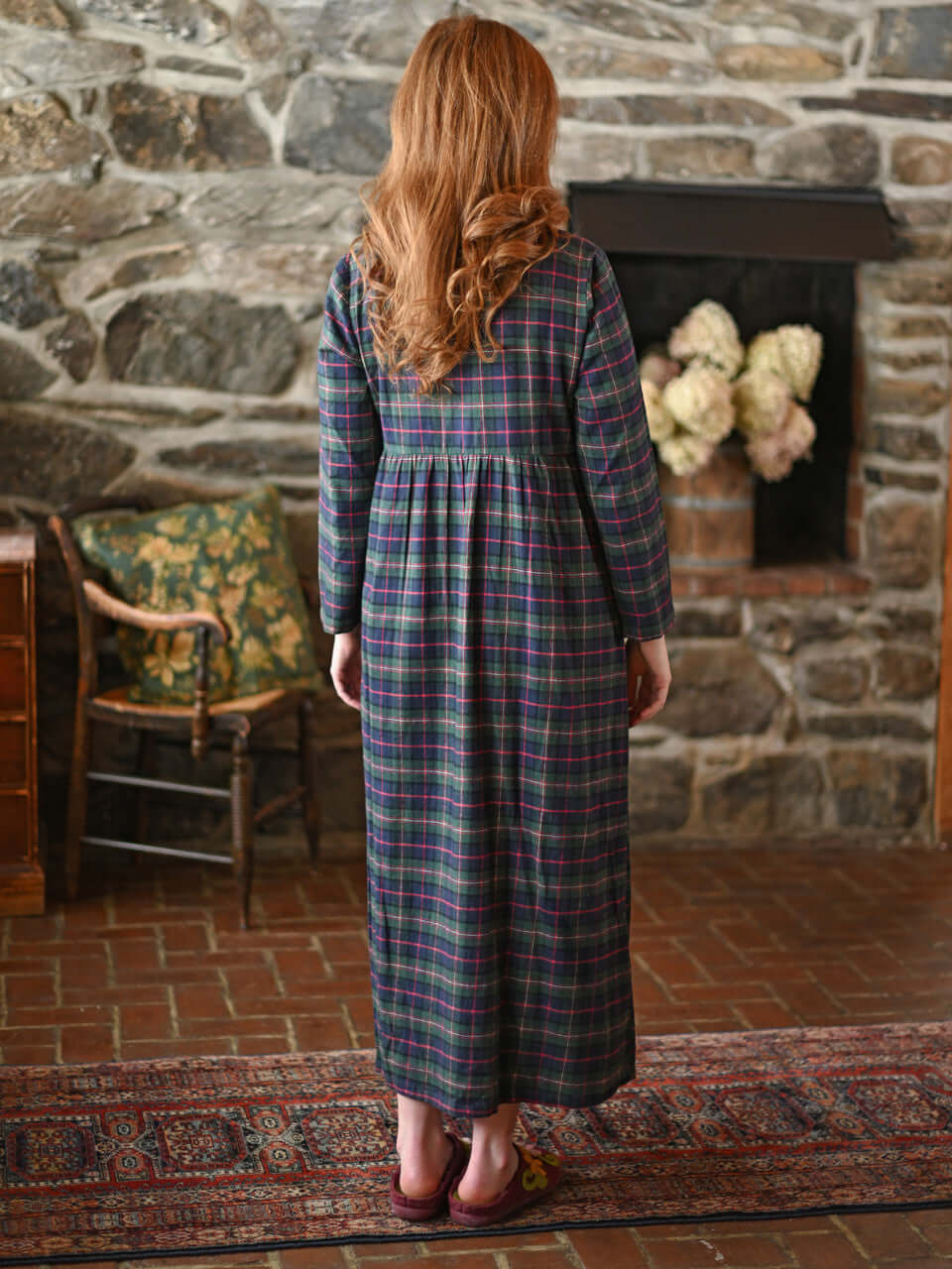 Back view of a woman wearing the Saratoga Long Flannel Cotton Nightgown in blue plaid from April Cornell.