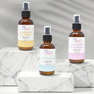 Eucalyptus Shower Mist bottles displayed on marble surface, highlighting eucalyptus & citrus, classic eucalyptus, and eucalyptus & lavender scents.