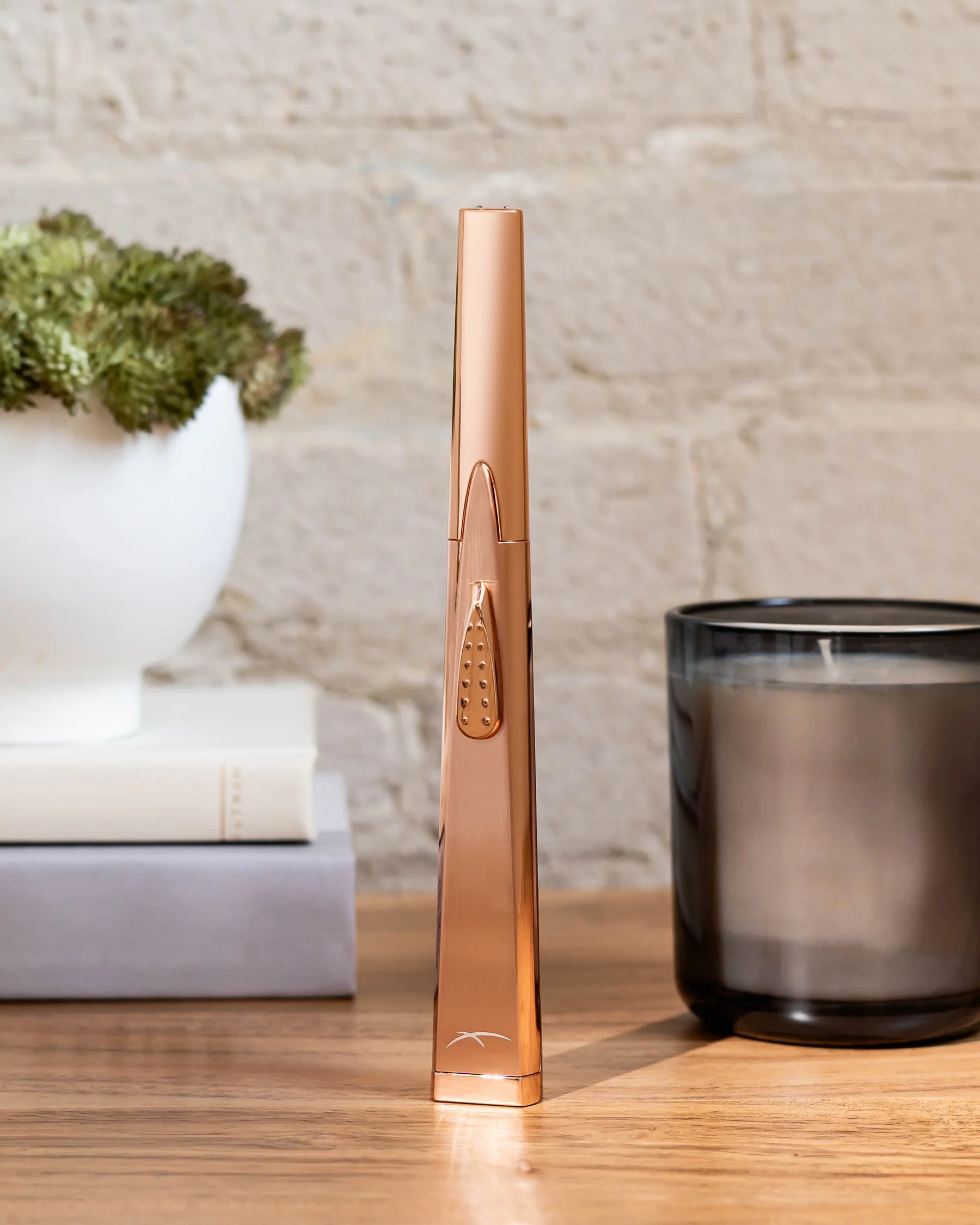 Sizzle Sleek Rechargeable Arc Lighter in rose gold lifestyle