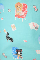 This Is How I Roll Dog Print Flannel PJ Set featuring playful dogs and poker cards in a vibrant pattern.