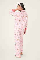 Model wearing the Tini Time Drink Print Flannel 3-Piece PJ Set from PJ Salvage, featuring a pink festive design.