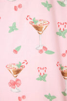 Tini Time drink print feature on a pink flannel fabric, showcasing festive cocktails and candy canes for the PJ Salvage set.