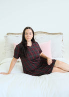 Georgia Rylan Bamboo Plaid V-Neck Nightshirt lifestyle model reclining on bed — Cloud Nine Pajamas Edmonton
