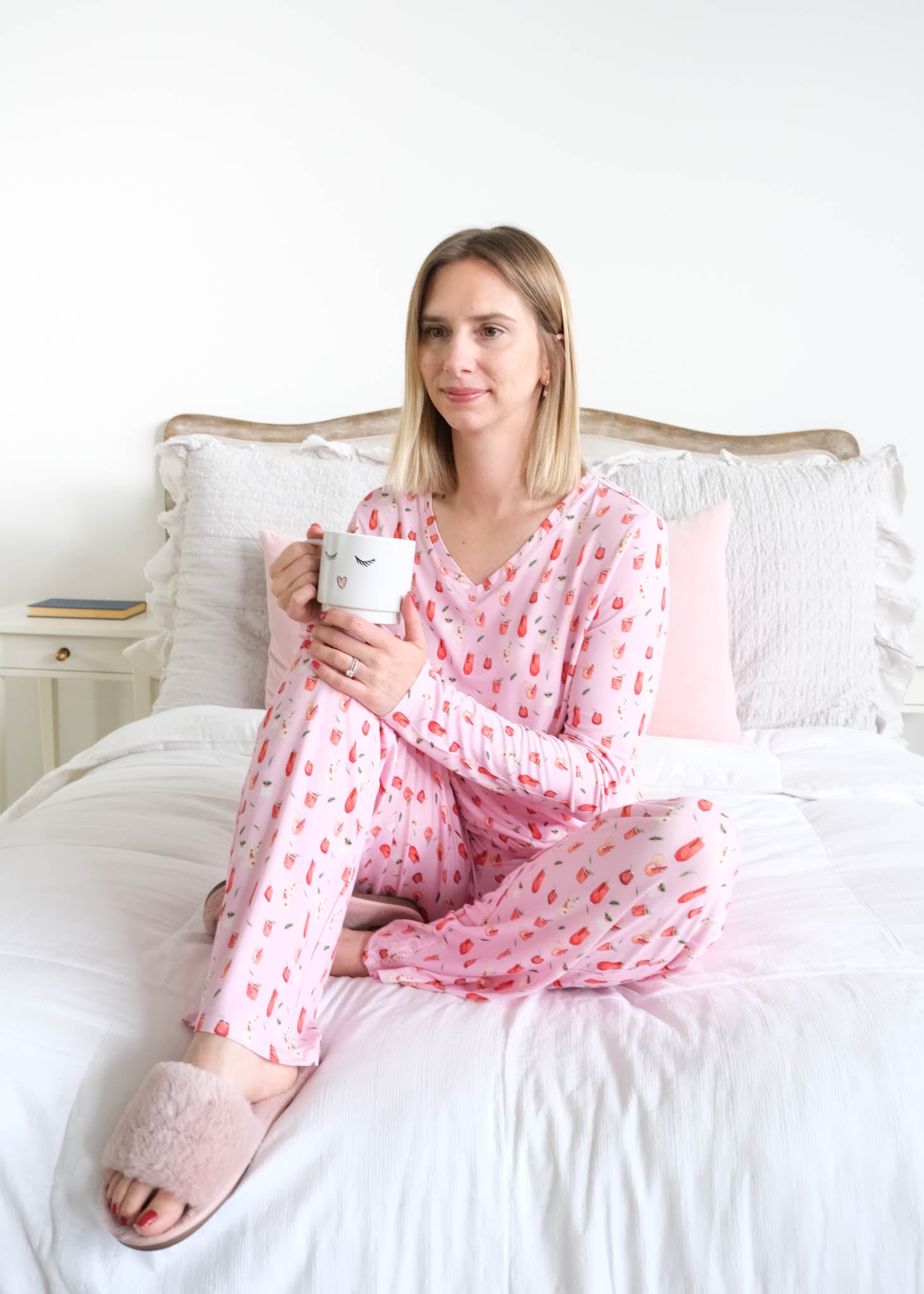 Georgia Rylan Cozy Cocktails V-Neck Bamboo PJ Set lifestyle front view seated on bed  — Cloud Nine Pajamas Edmonton