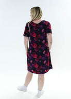 Model wearing the Winter Blossom V Neck Bamboo Nightshirt with Pockets, showing back. Features colorful floral print.