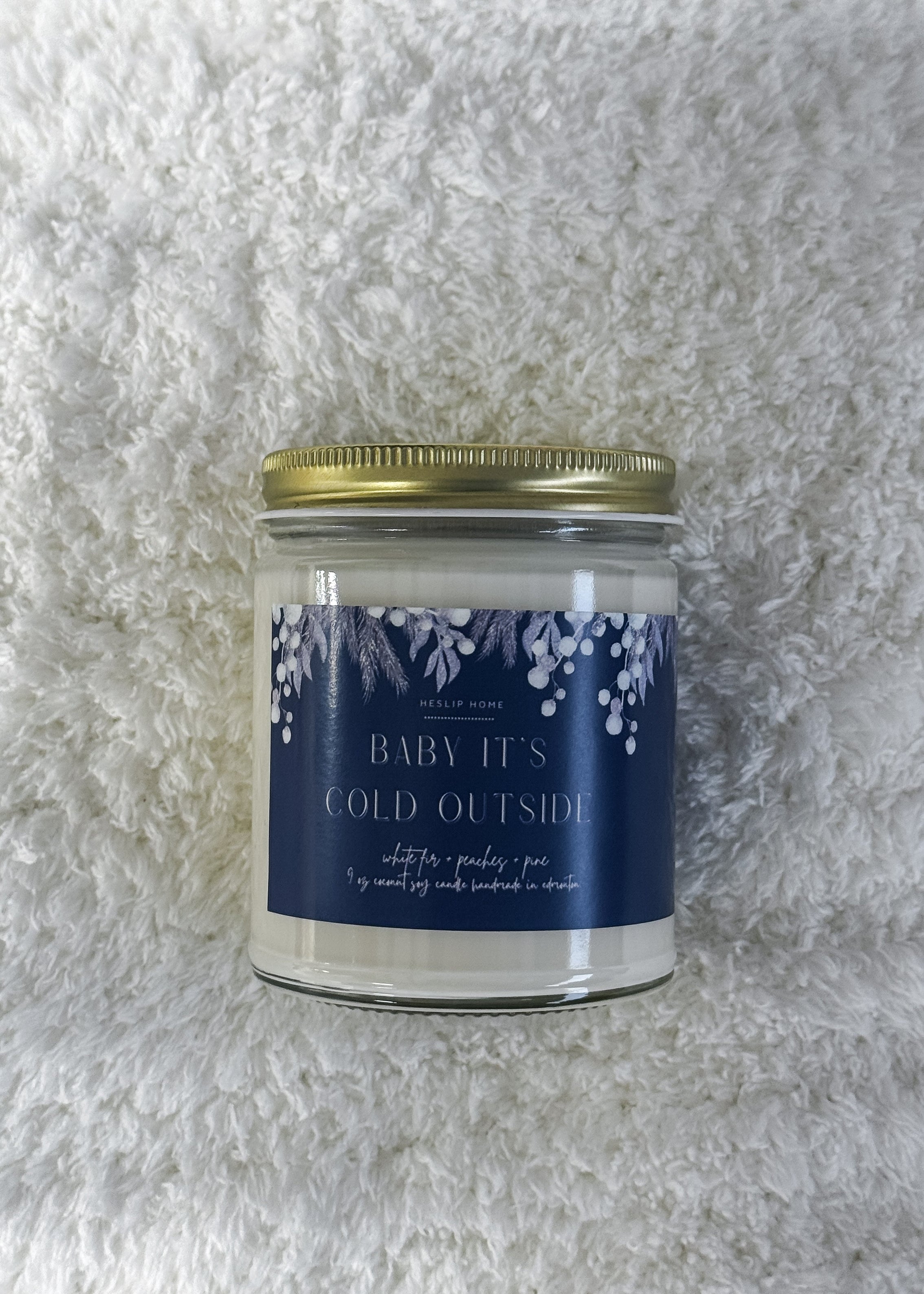 baby its cold outside candle with notes of the woods - fir and pine - plus sweet peaches