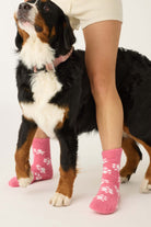 Pair of PJ Salvage Pink Fuzzy Cozy Socks with the adorable all-over paw print design. Showing the plush texture and mid-height crew cut.