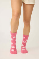 Pair of PJ Salvage Pink Fuzzy Cozy Socks with the adorable all-over paw print design. Showing the plush texture and mid-height crew cut.