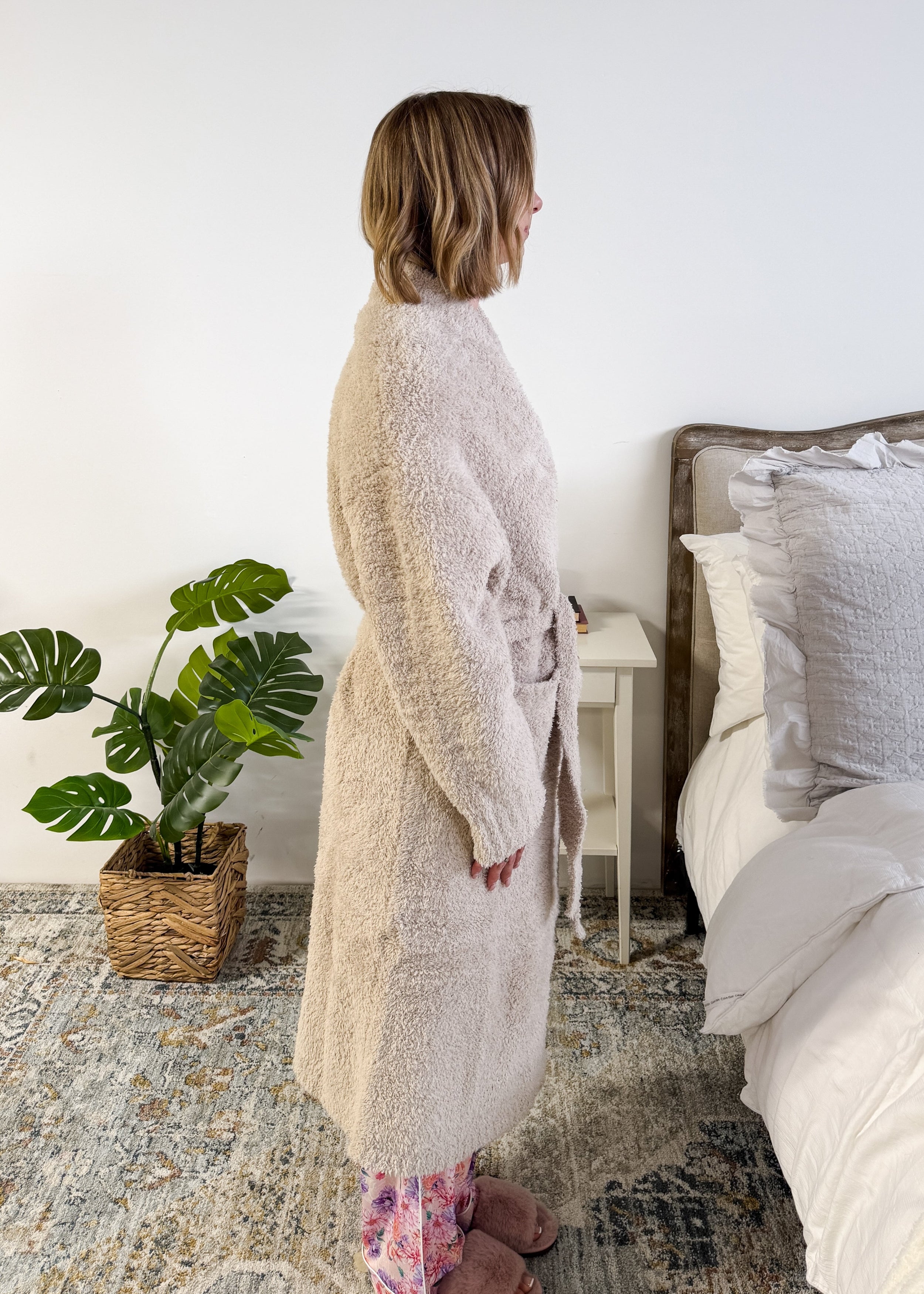Sand Beige Chenille Cloud Spa Robe – Plush Stretch Robe with Pockets side profile shot on model standing in a bedroom setting