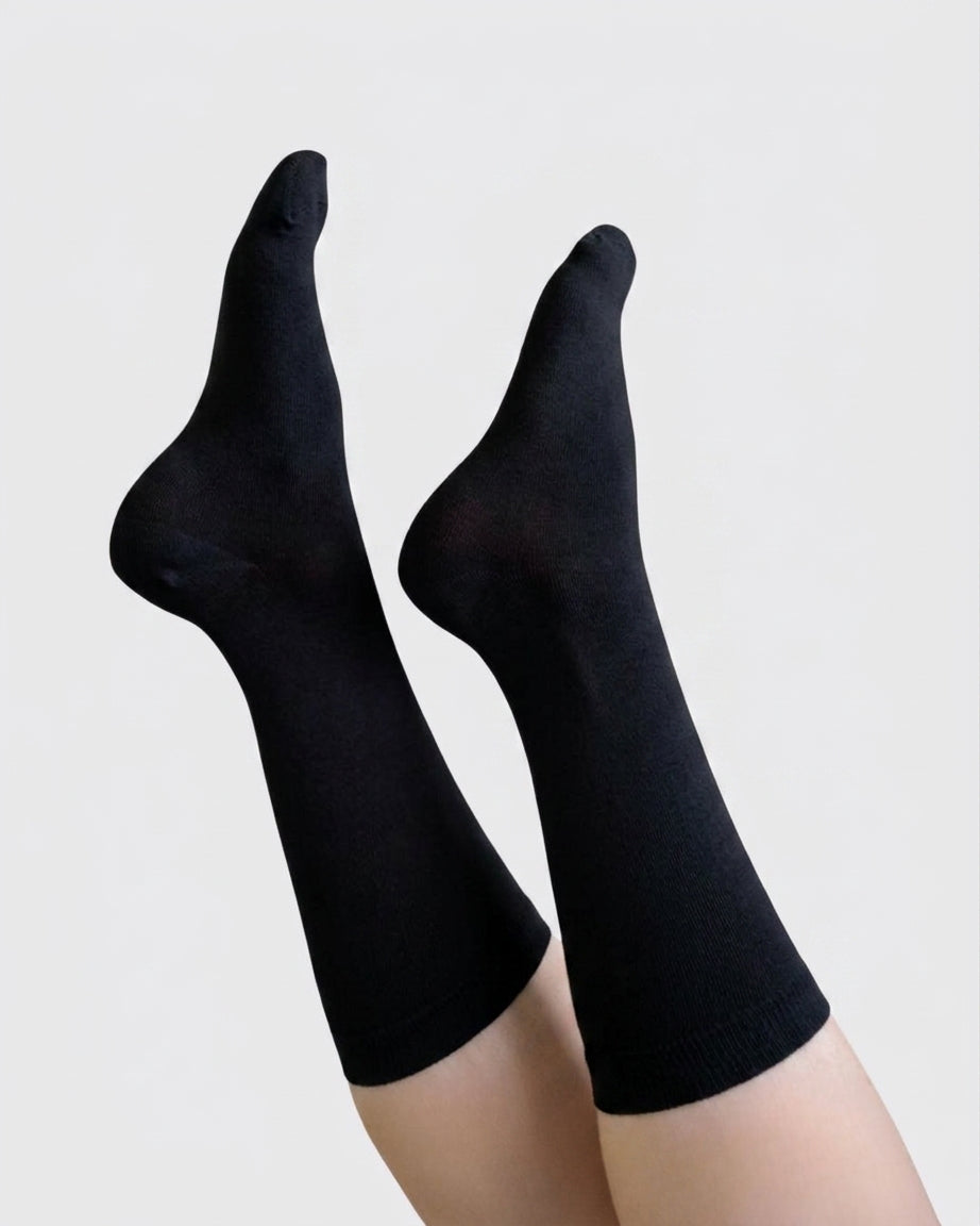 Georgia Rylan black bamboo crew sock on model full length — Cloud Nine Pajamas