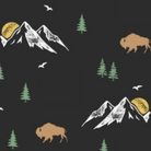 A repeating pattern featuring white and gray mountain peaks, green pine trees, brown bison, and small white birds on a dark charcoal background.