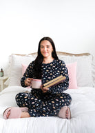 Miranda Nic Book Club Velour Straight Leg PJ Set lifestyle closeup on bed with books — Cloud Nine Pajamas Edmonton