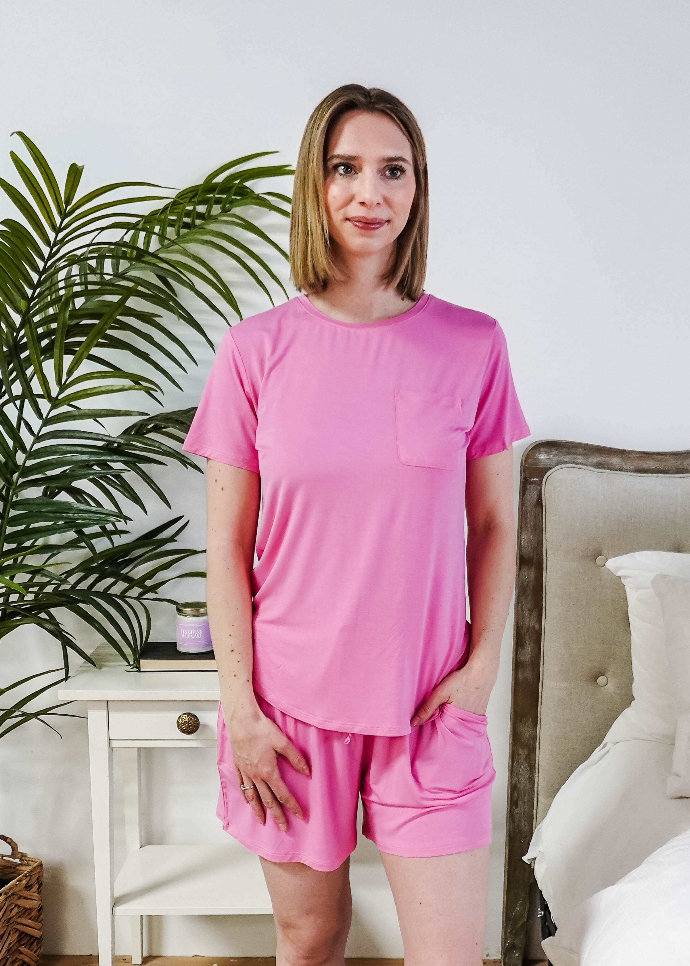 Model wearing a Bubblegum Pink Tee Short Bamboo Pajama Set, featuring a stylish pocket and comfortable fit.