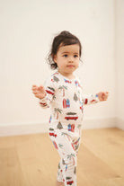 baby sleeper in beachy cali christmas print from bambi and birdie