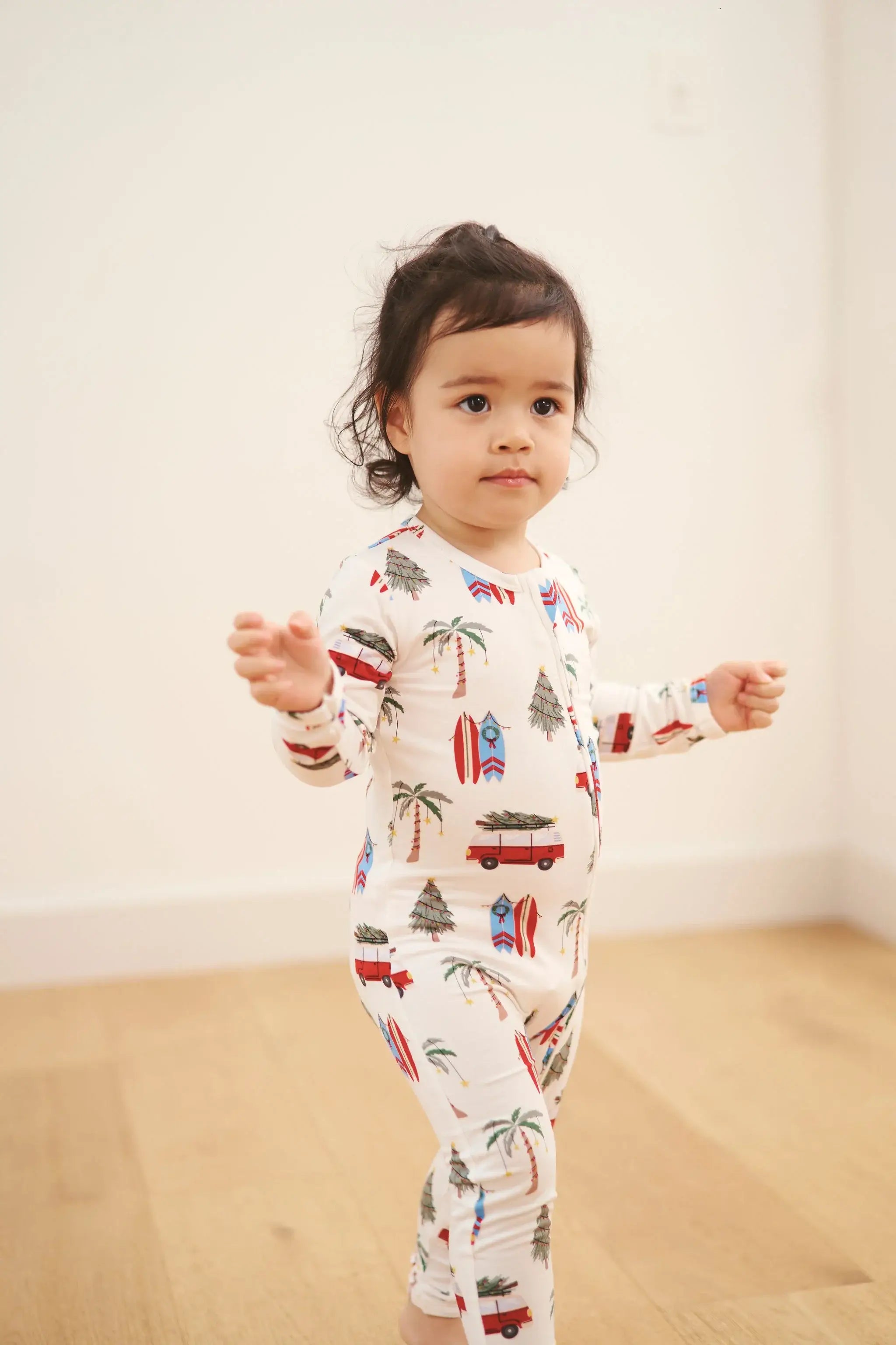 baby sleeper in beachy cali christmas print from bambi and birdie