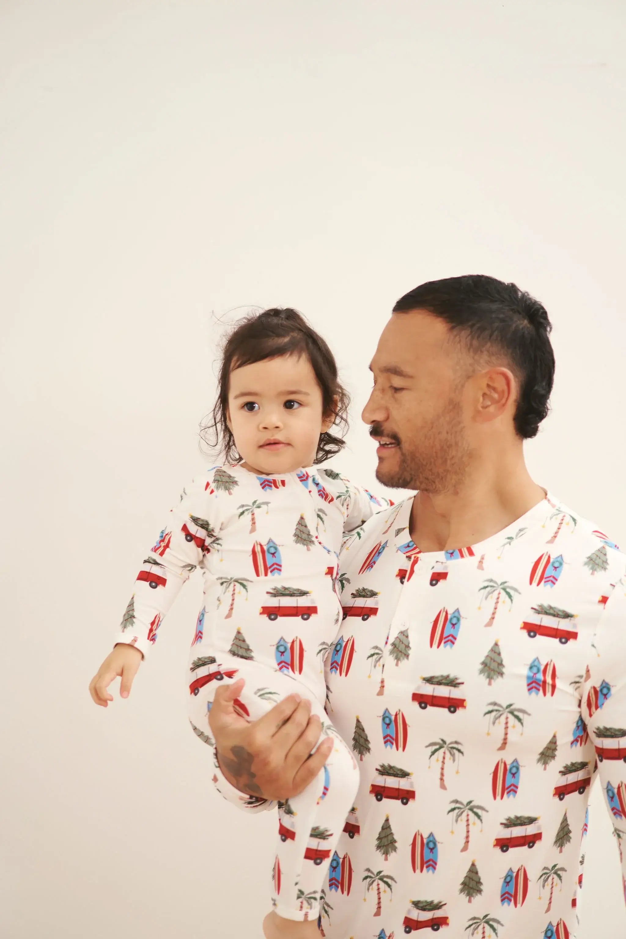 baby sleeper in beachy cali christmas print from bambi and birdie