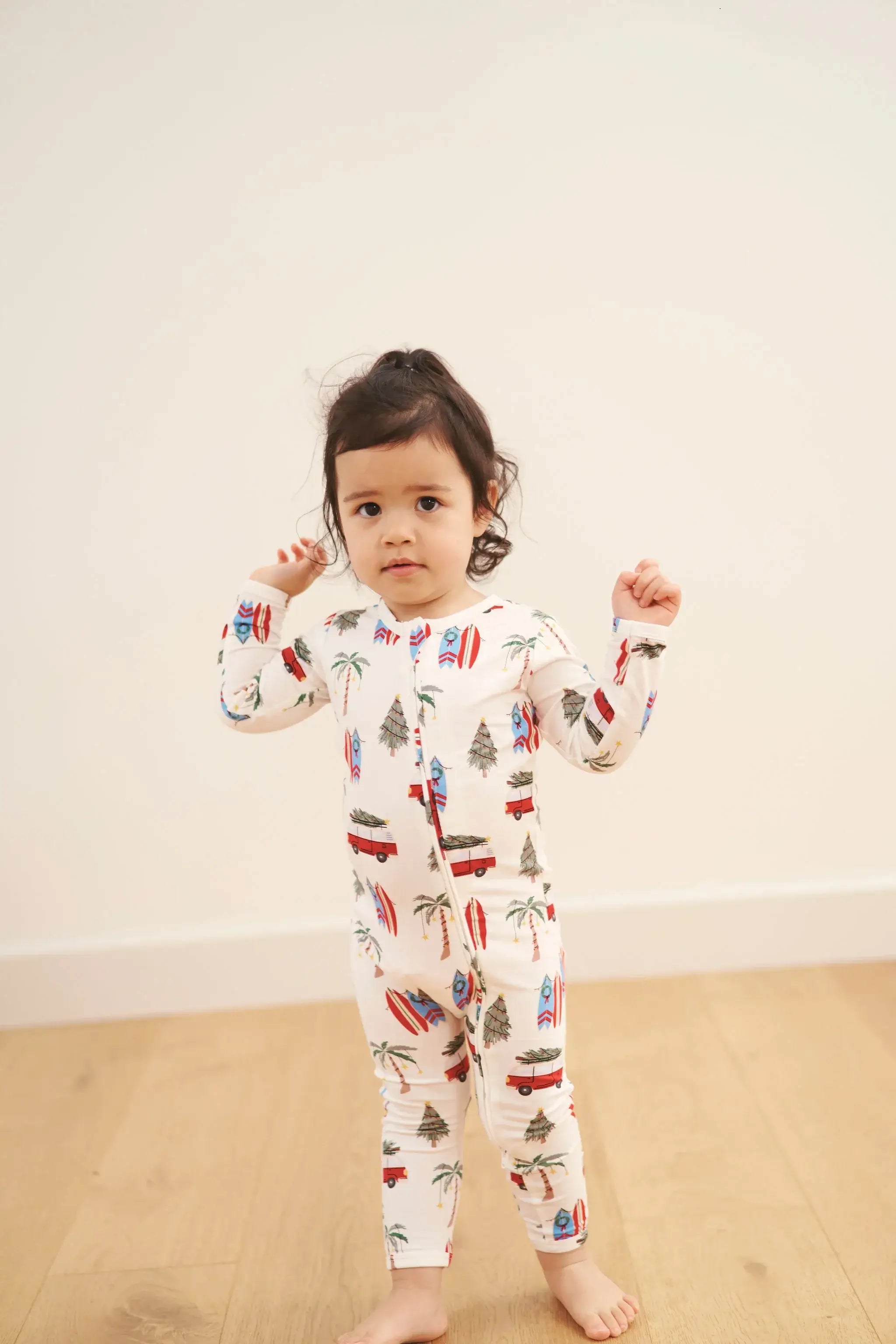 baby sleeper in beachy cali christmas print from bambi and birdie