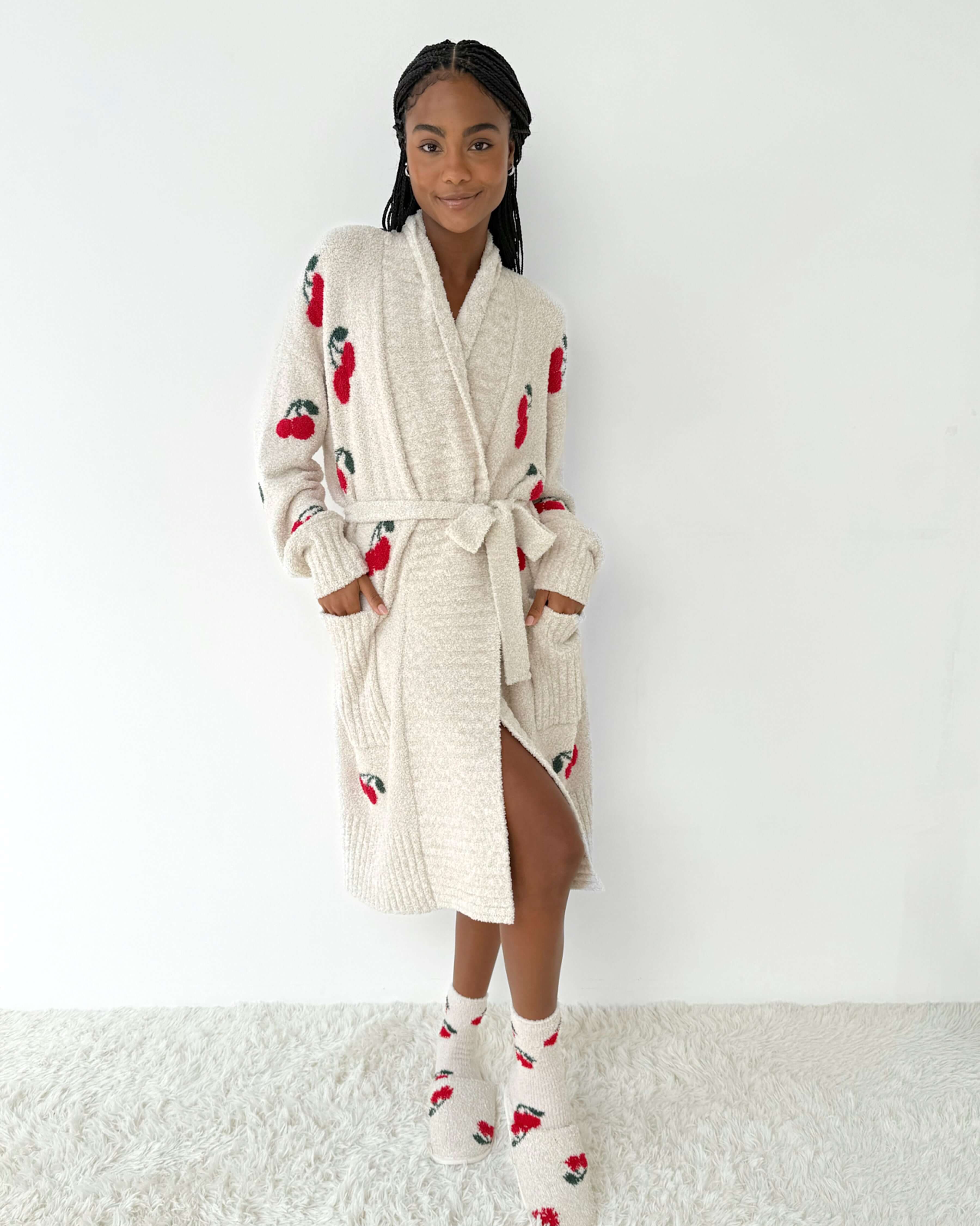 Model wearing the Pomona Fuzzy Yarn Robe Splendid, ultra-soft cozy loungewear with cherry patterns.