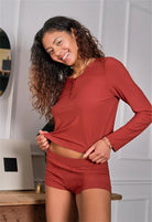 Model wearing the Chili Rib TENCEL™ Modal Cropped Henley Top, paired with boy shorts. Highlighting the slight crop, functional buttons, and ribbed texture.