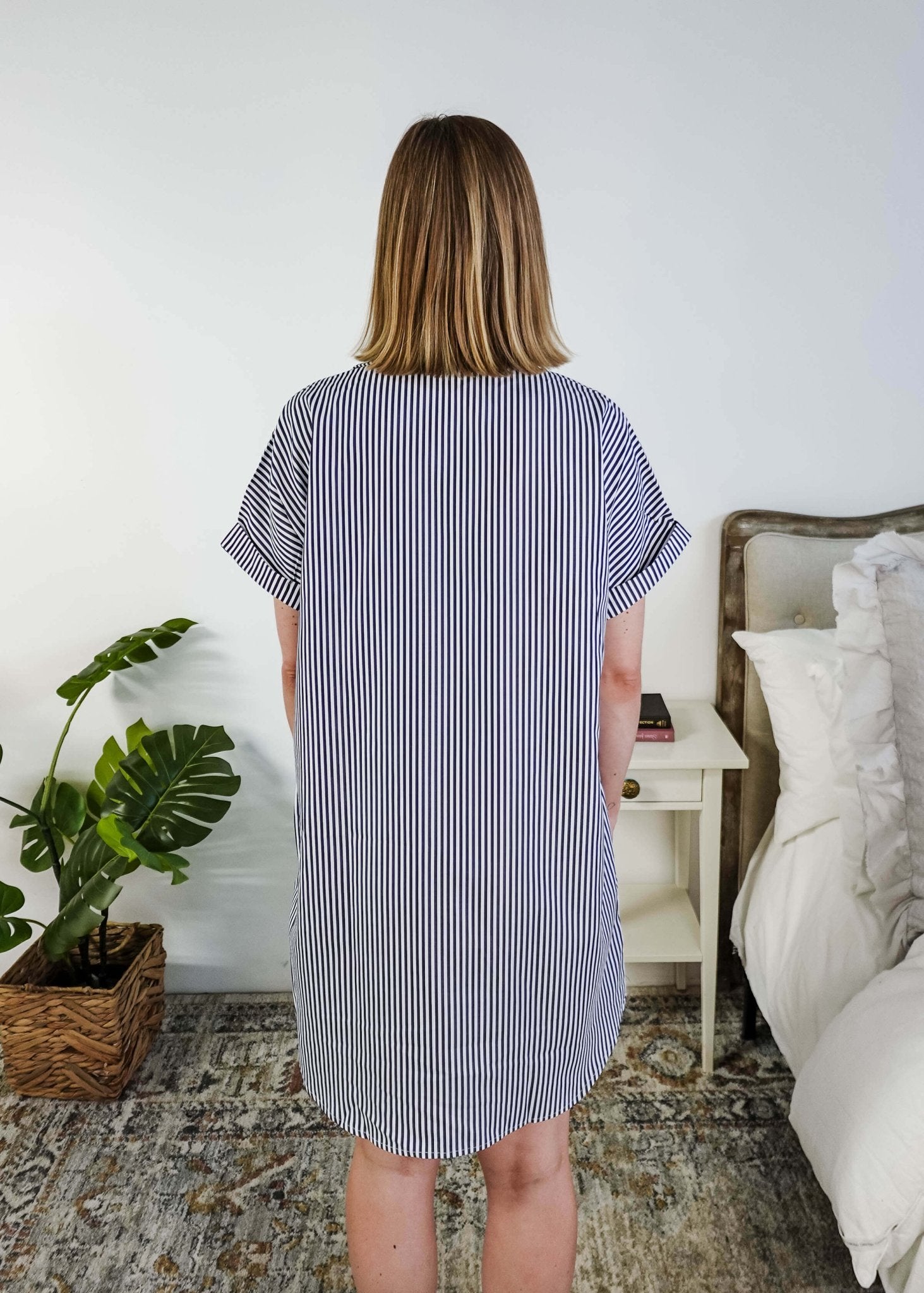 Person wearing a blue and white striped dress in a bedroom setting, Scarlett Ellie Collared Button-Up Short Sleeve Dress | Cloud Nine Pajamas