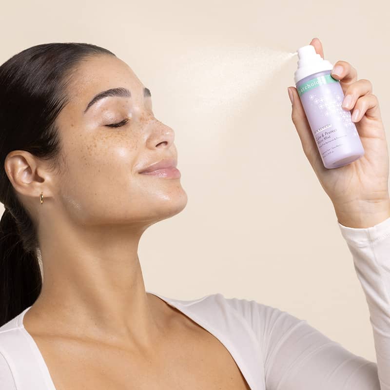 Cozy Comforts Soothing & Protecting Skincare Essential Kit Patchology spray application on glowing skin.