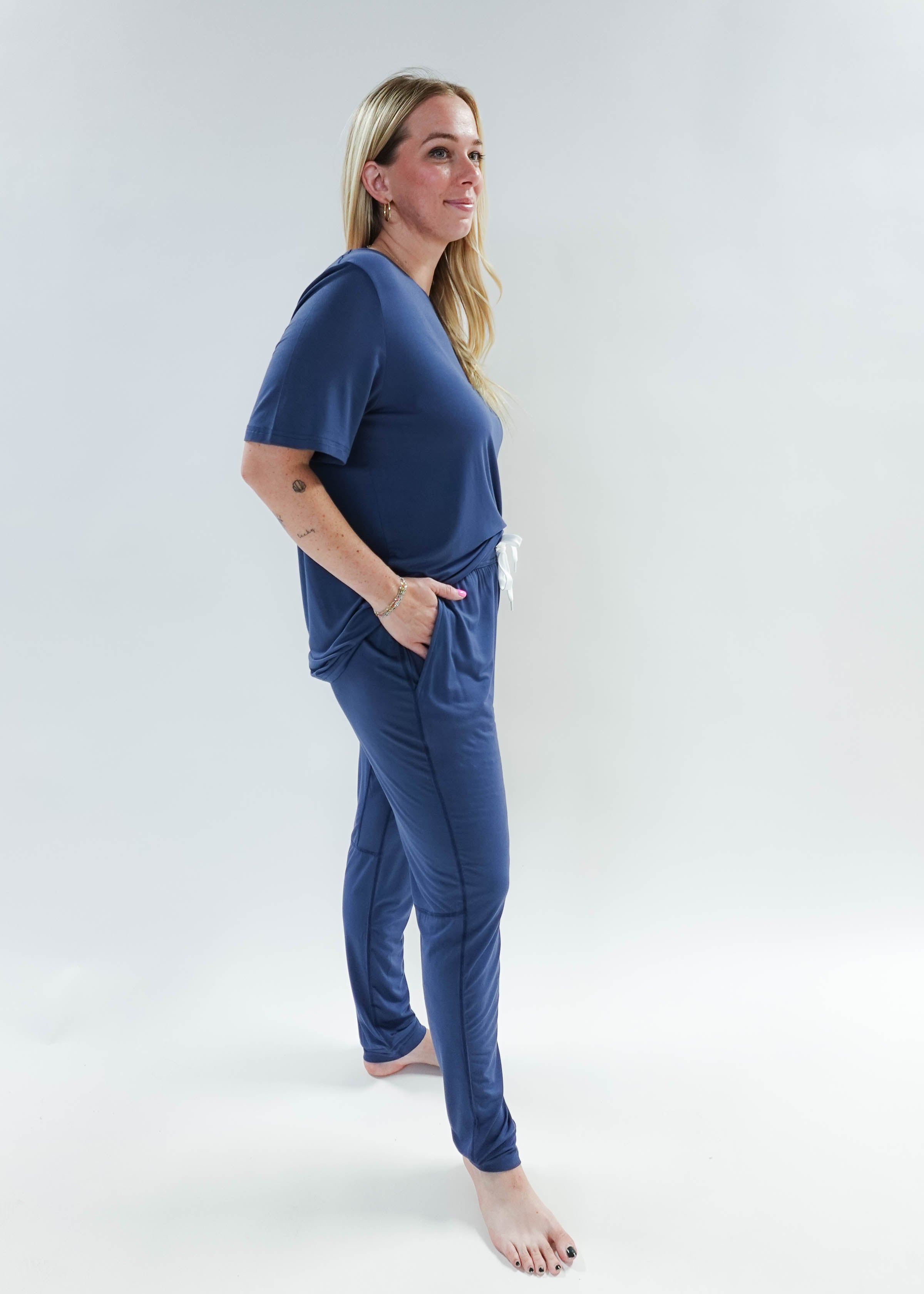 Model wearing Denim Blue Unisex Bamboo Jogger from Bob's Sleepwear Co., showcasing comfort and style.