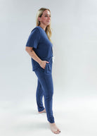 Model wearing Denim Blue Unisex Bamboo Jogger from Bob's Sleepwear Co., showcasing comfort and style.