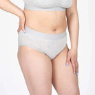 Devon + Lang Bria Full Coverage Bikini Brief showcasing grey fabric and comfortable fit on a model.
