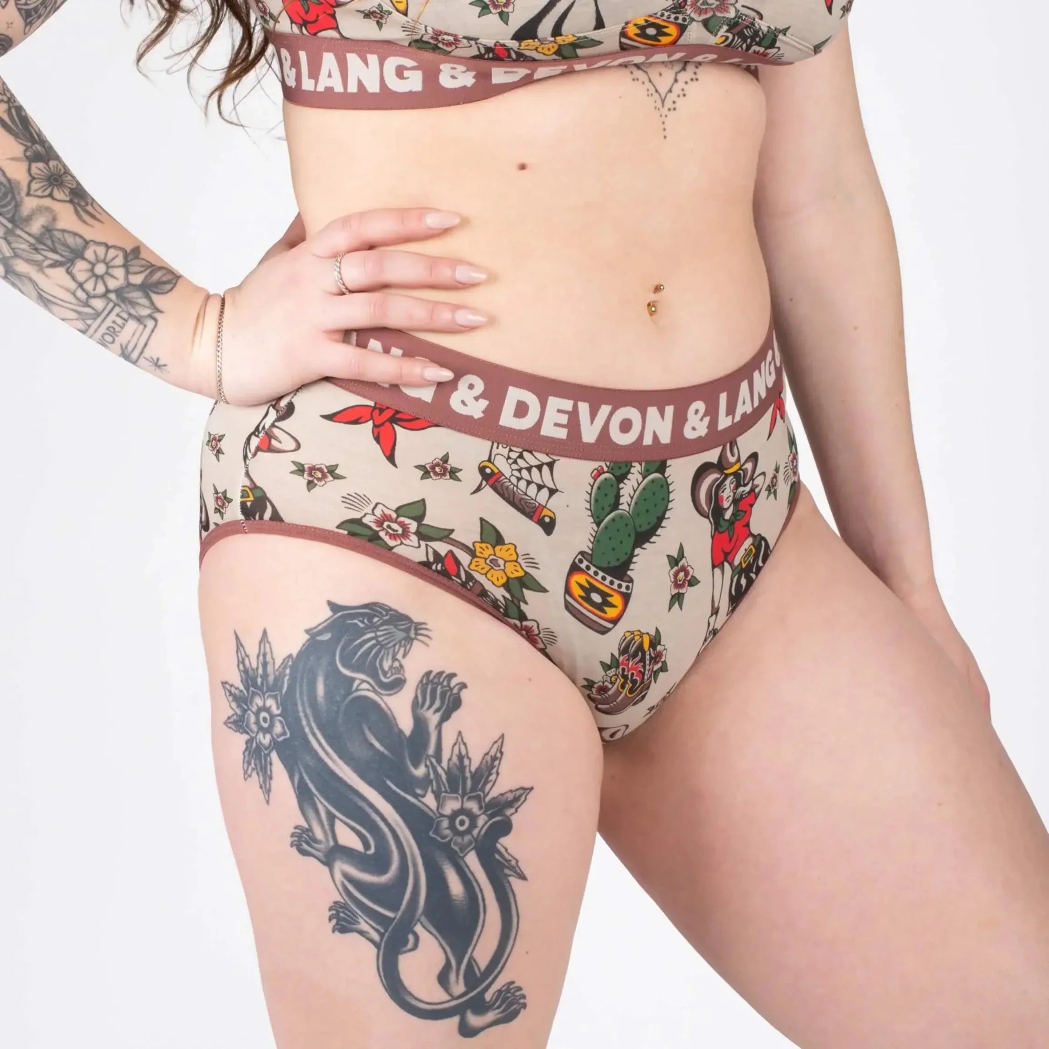 Devon + Lang Bria Full Coverage Bikini Brief with tattooed model showcasing unique pattern and branding.