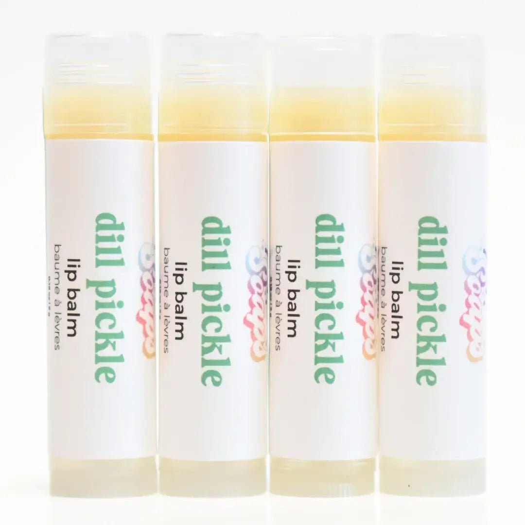 Dill Pickle Lip Balm tubes arranged in a row, featuring a crunchy dill pickle flavor and hydrating ingredients.