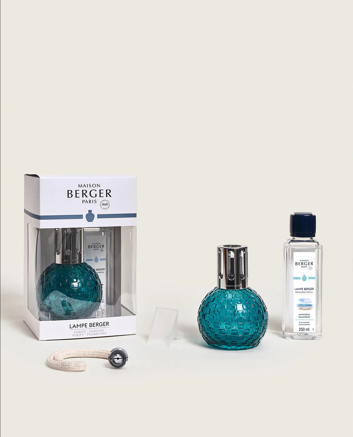 Maison Berger Paris Disco Fragrance Lamp Gift Set in teal, with fragrance bottle and packaging on display.