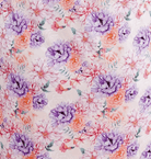 Dream in Blooms floral pattern featuring vibrant purple and pink flowers with butterflies.