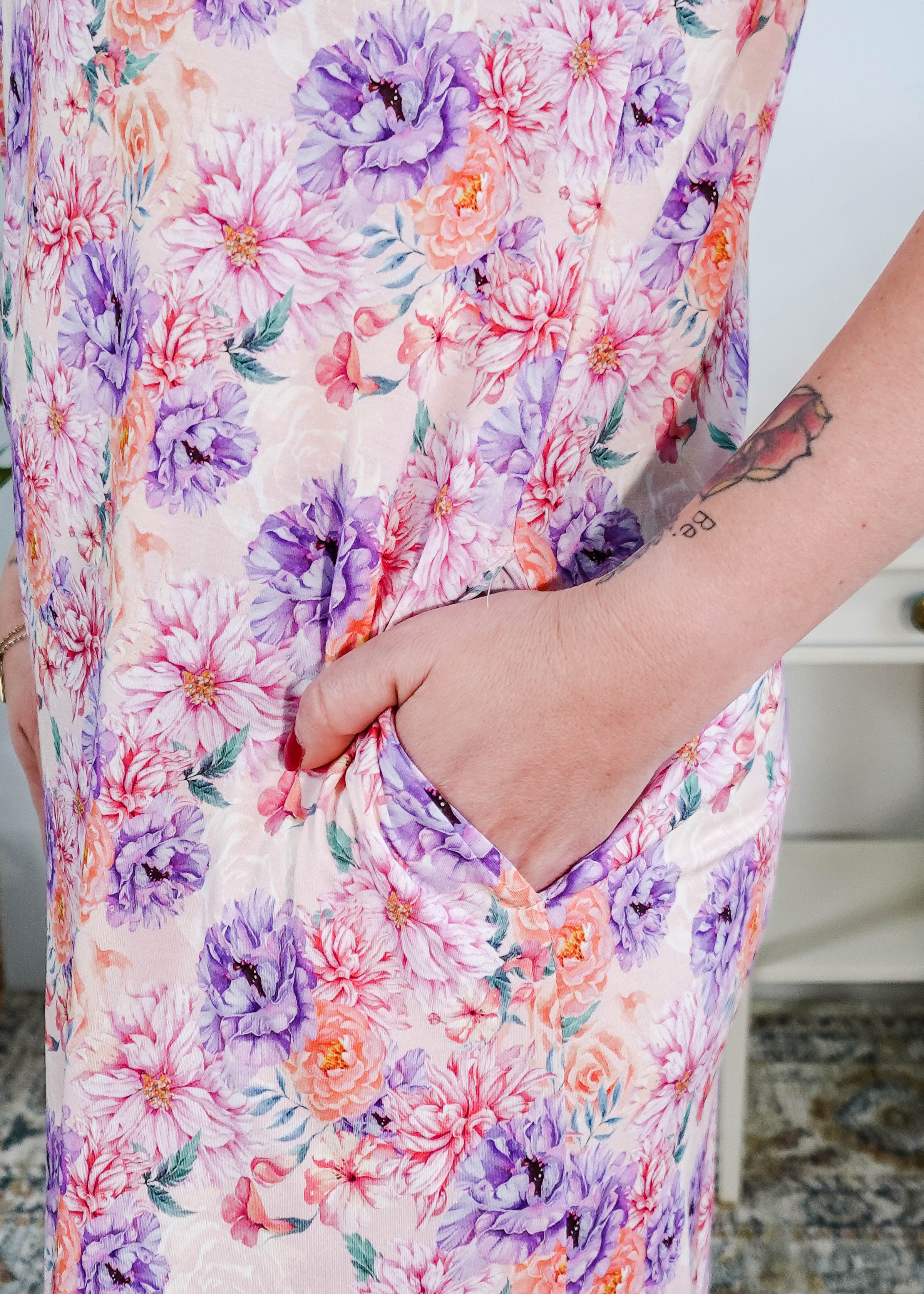 Dream in Blooms V Neck Nightshirt With Pockets featuring vibrant floral print and convenient side pockets.