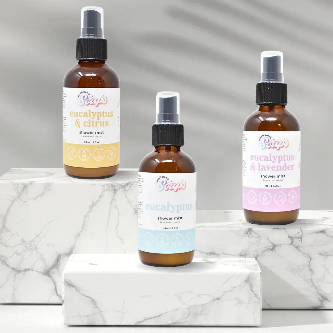 Eucalyptus Shower Mist bottles displayed on marble surface, highlighting eucalyptus & citrus, classic eucalyptus, and eucalyptus & lavender scents.