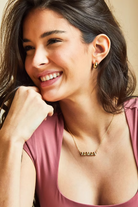 Forever Mama Necklace in 14K Gold featuring balloon-style lettering spelling 'MAMA' on a delicate chain.