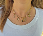 Bella Charm Necklace in 14K Gold featuring five charms: heart, star, bow, love script, and pearl heart.