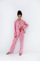 Model wearing the Sensis Giuliana Flannel Pajamas in a button-up shirt and long straight pants, showing the elegant cut.