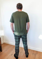 Man wearing Green Plaid unisex bamboo jogger from Bob's Sleepwear Co. shown from the back.
